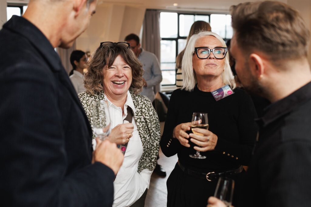 Guests talking at the Blue Goose Briefing event about change and transformation